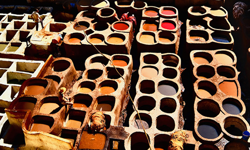 Stone pots of liquids and dyes, Chouara Tannery, Fez. Wellington architect, Auckland architect, Christchurch architect, Tauranga architect